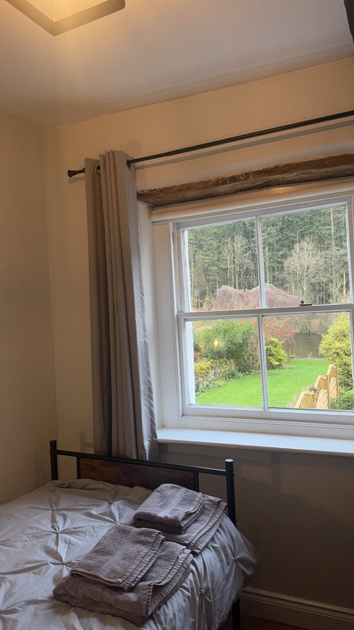 View from the riverside bedroom across the garden towards the River Eamont
