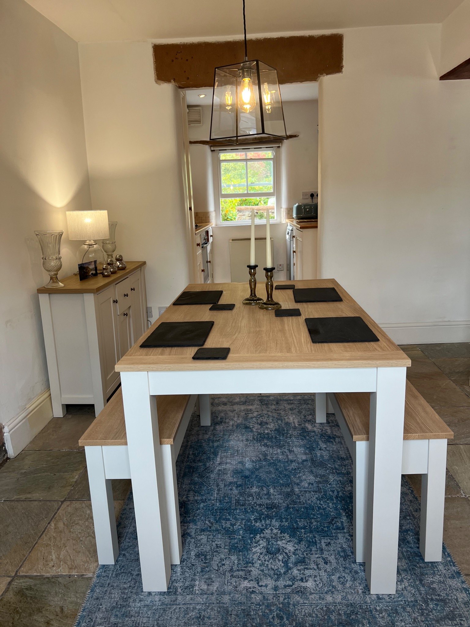 Dining area with kitchen beyond